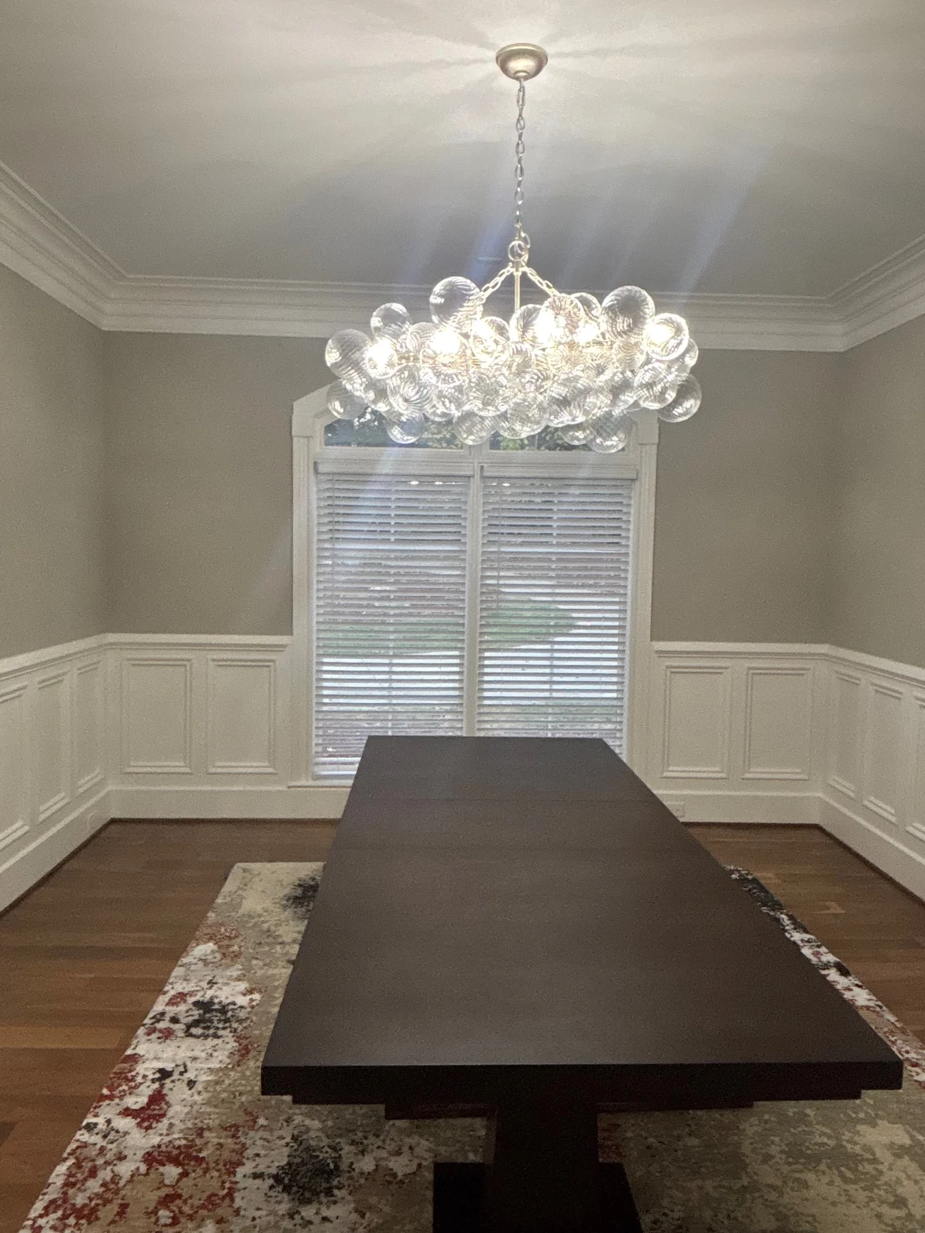 Finished residential dining room with decorative lighting