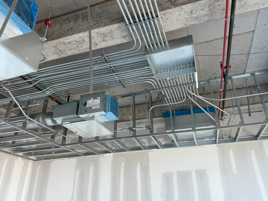 Overhead conduit and junction enclosure