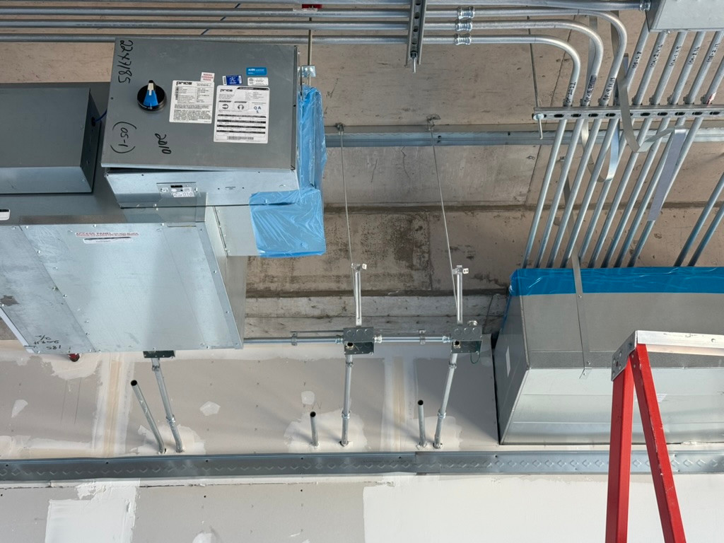 Conduit routing around mechanical equipment