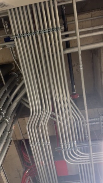 Overhead conduit bends and supports