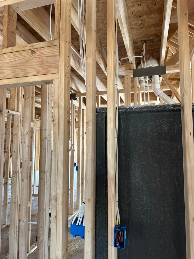 Wiring beside a framed bathroom